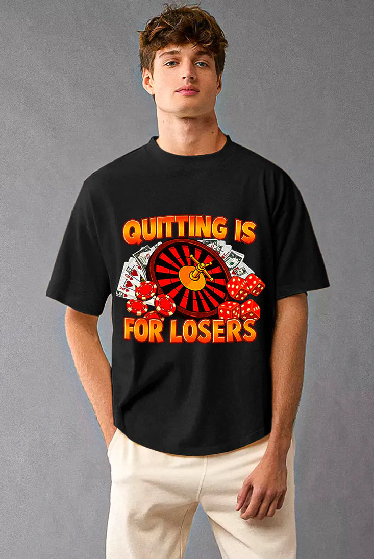 Person wearing a black t-shirt with a motivational design on a gray background